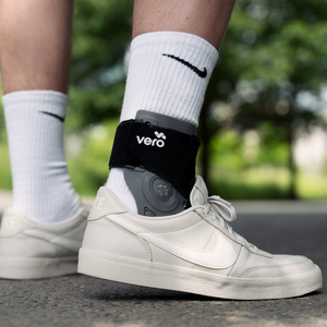 Man wearing casual nike shoes on a walk with the Vero Ankle® Brace over his white socks.