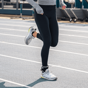 A man running while wearing the Vero Ankle® brace.